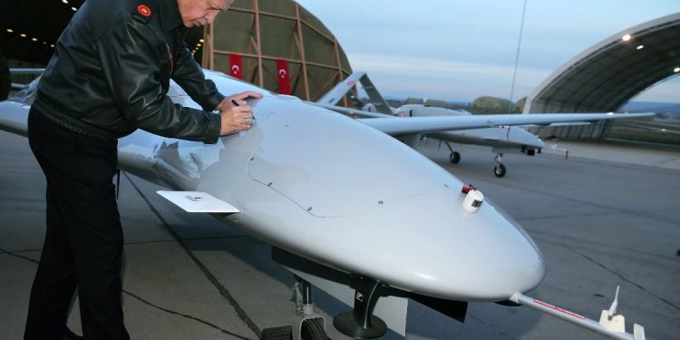 Turkey’s presidente Recep Tayyip Erdogan signs a drone in the Batman airbase