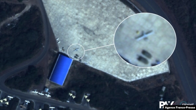 This handout satellite image taken Dec. 9, 2021, by Planet Labs PBC shows what Dutch peace organization PAX says is a Turkish Bayrakter TB-2 drone parked outside a hangar at the northern part of Hara Meda airbase in Bishoftu, Ethiopia. (Planet Labs PBC/AFP)