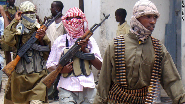 Al-Shabab militia patrol a market in Mogadishu, Somalia [Photo: AFP]